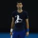 MELBOURNE, AUSTRALIA - JANUARY 14: Novak Djokovic of Serbia looks on during a practice session ahead of the 2022 Australian Open at Melbourne Park on January 14, 2022 in Melbourne, Australia. (Photo by Daniel Pockett/Getty Images)