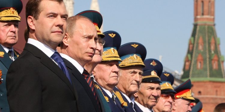 From left, Russian President Dmitry Medvedev, Prime Minister Vladimir Putin, stand wtih World War II veterans during the annual Victory Day parade on Moscow's Red Square, Saturday, May 9, 2009. Victory Day, marking the defeat of Nazi Germany, is Russia's most important secular holiday, and the parade reflected the Kremlin's efforts to revive the nation's armed forces and global clout. (AP Photo/RIA-Novosti, Mikhail Klimentyev, Presidential Press Service)