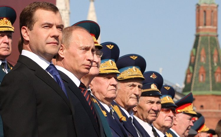 From left, Russian President Dmitry Medvedev, Prime Minister Vladimir Putin, stand wtih World War II veterans during the annual Victory Day parade on Moscow's Red Square, Saturday, May 9, 2009. Victory Day, marking the defeat of Nazi Germany, is Russia's most important secular holiday, and the parade reflected the Kremlin's efforts to revive the nation's armed forces and global clout. (AP Photo/RIA-Novosti, Mikhail Klimentyev, Presidential Press Service)