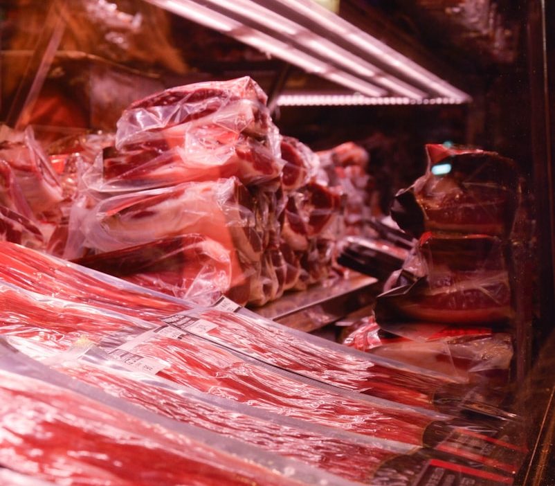 macro photography of meat in chiller